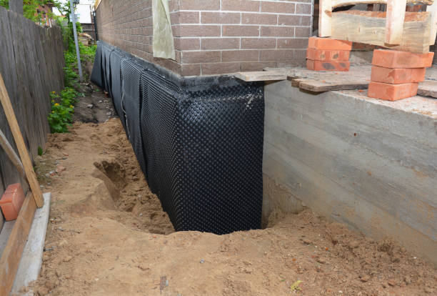 SJ Waterproofing Pros technician performing targeted Emergency Waterproofing assessment in Hartland, MI